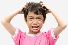Boy scratching head